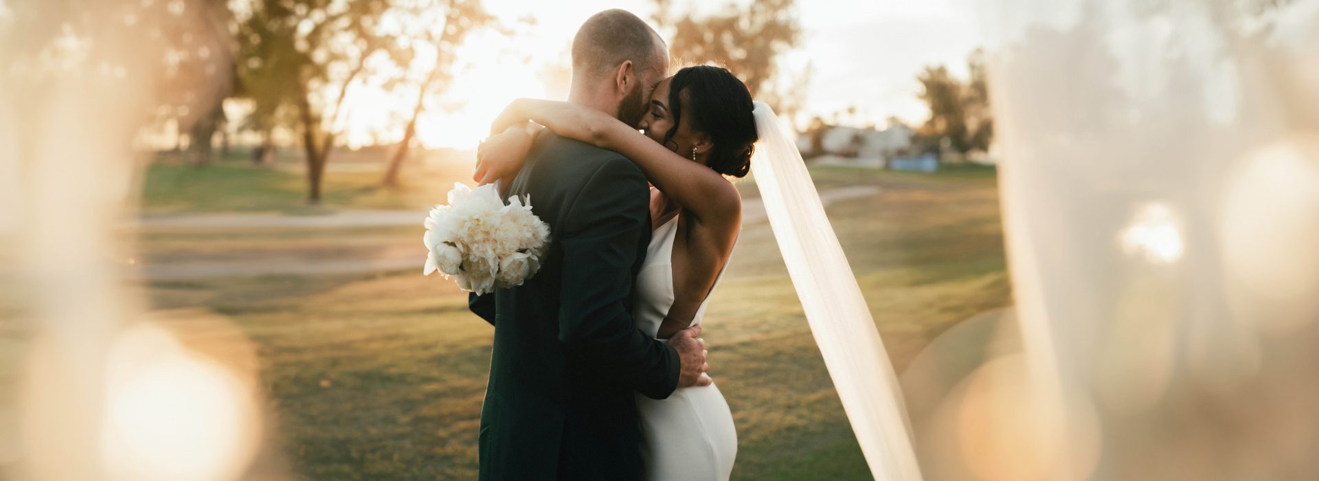 Couple hugging at sunset