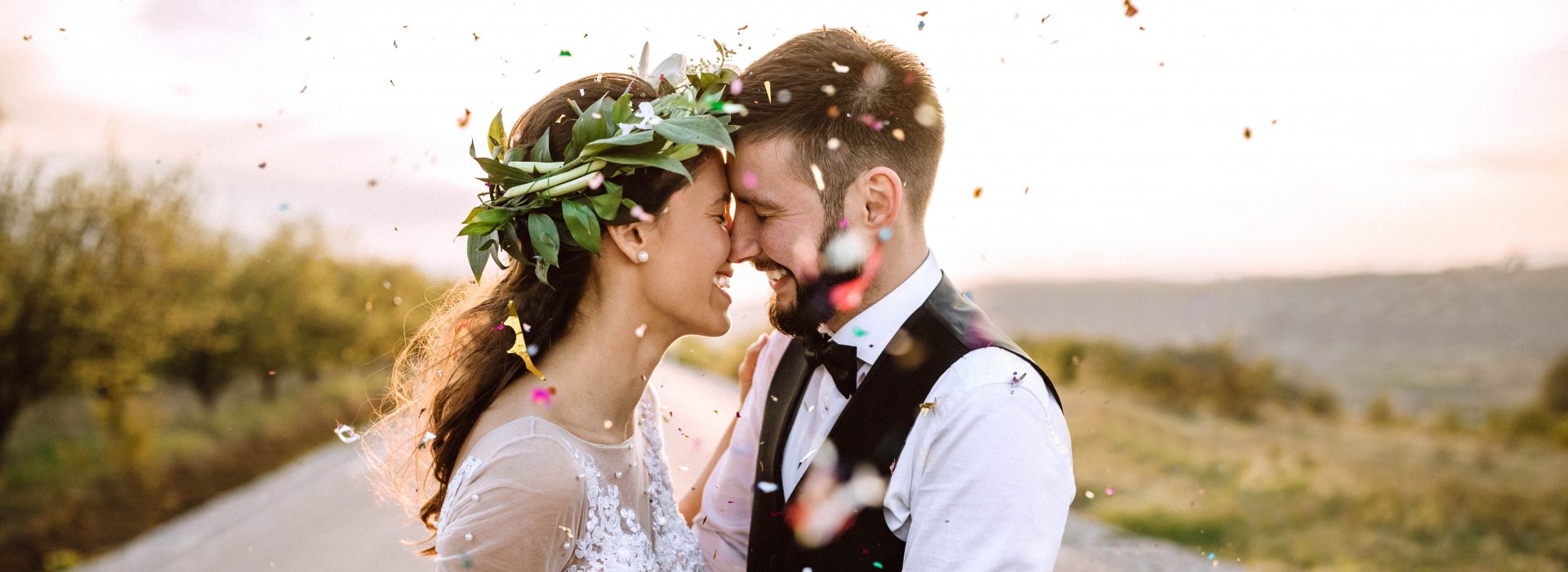 Bridal couple at wedding ceremony with confetti