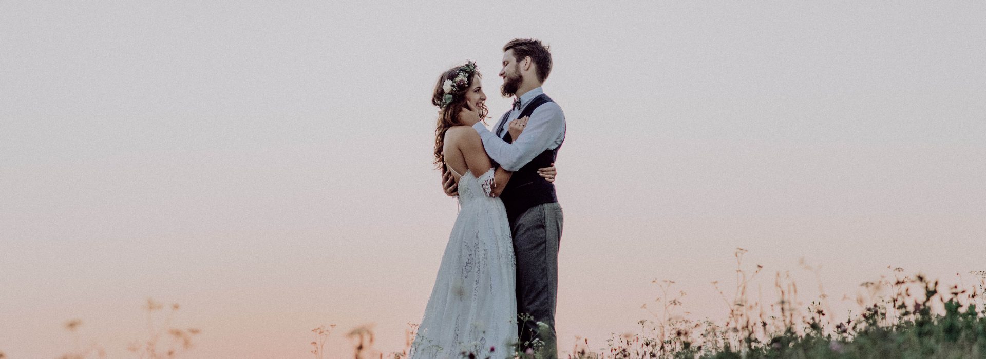 Couple hugging at sunset