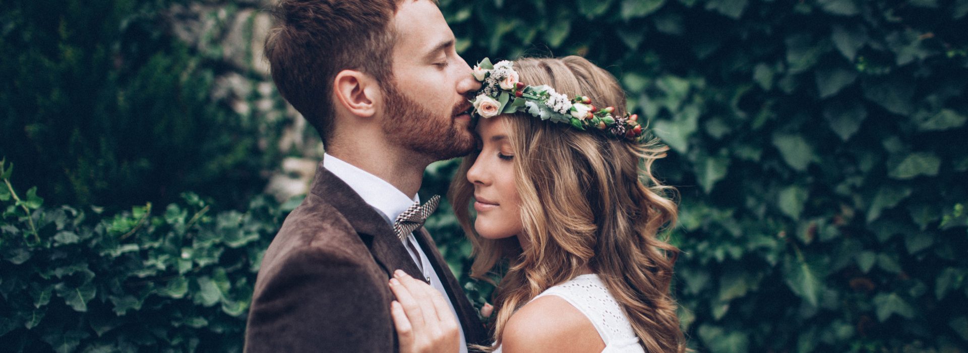 Bride and groom kissing at the wedding
