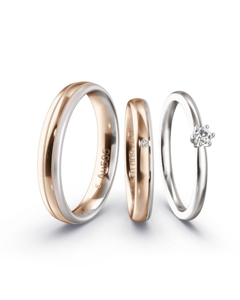 Triset wobei die Eheringe aus Caramelgold poliert und Weißgold Feinmatt sind der Solitär ist Weißgold