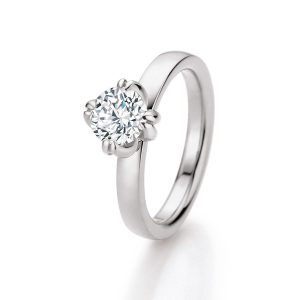 White gold wedding ring with oval diamond in three-leaf setting, timeless modern design