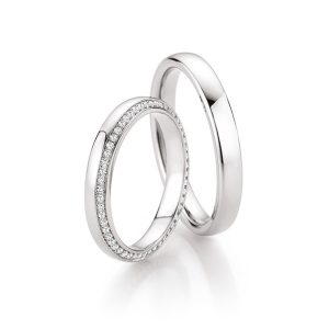 Two white gold wedding rings with diamonds